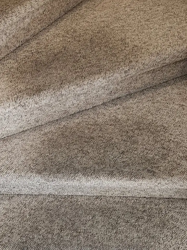 Carpeted stairs with dark worn treads before cleaning